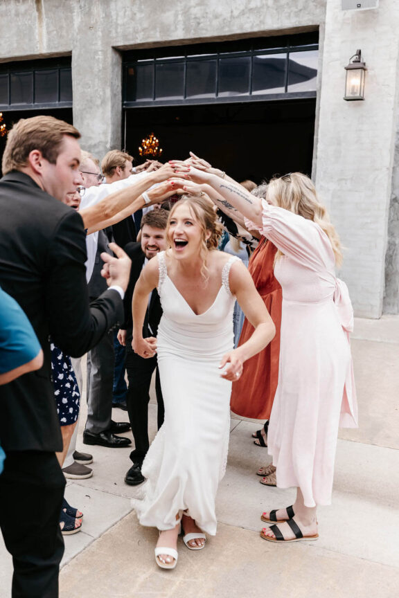 The bride leads a dance line.