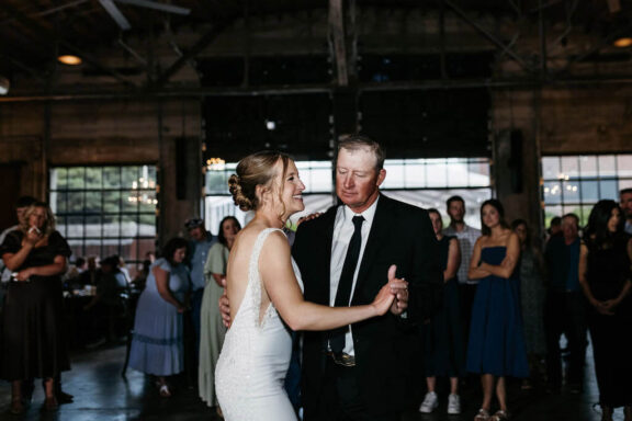 The bride dances with her father.
