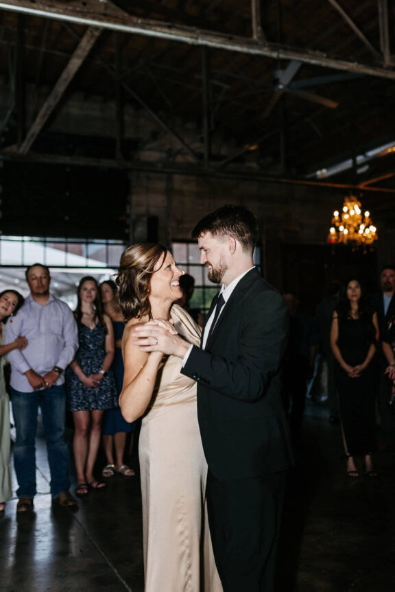 The groom dances with his mother.