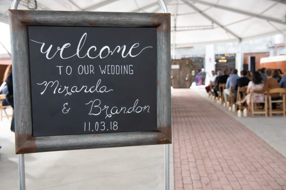 Wedding ceremony inside large tent